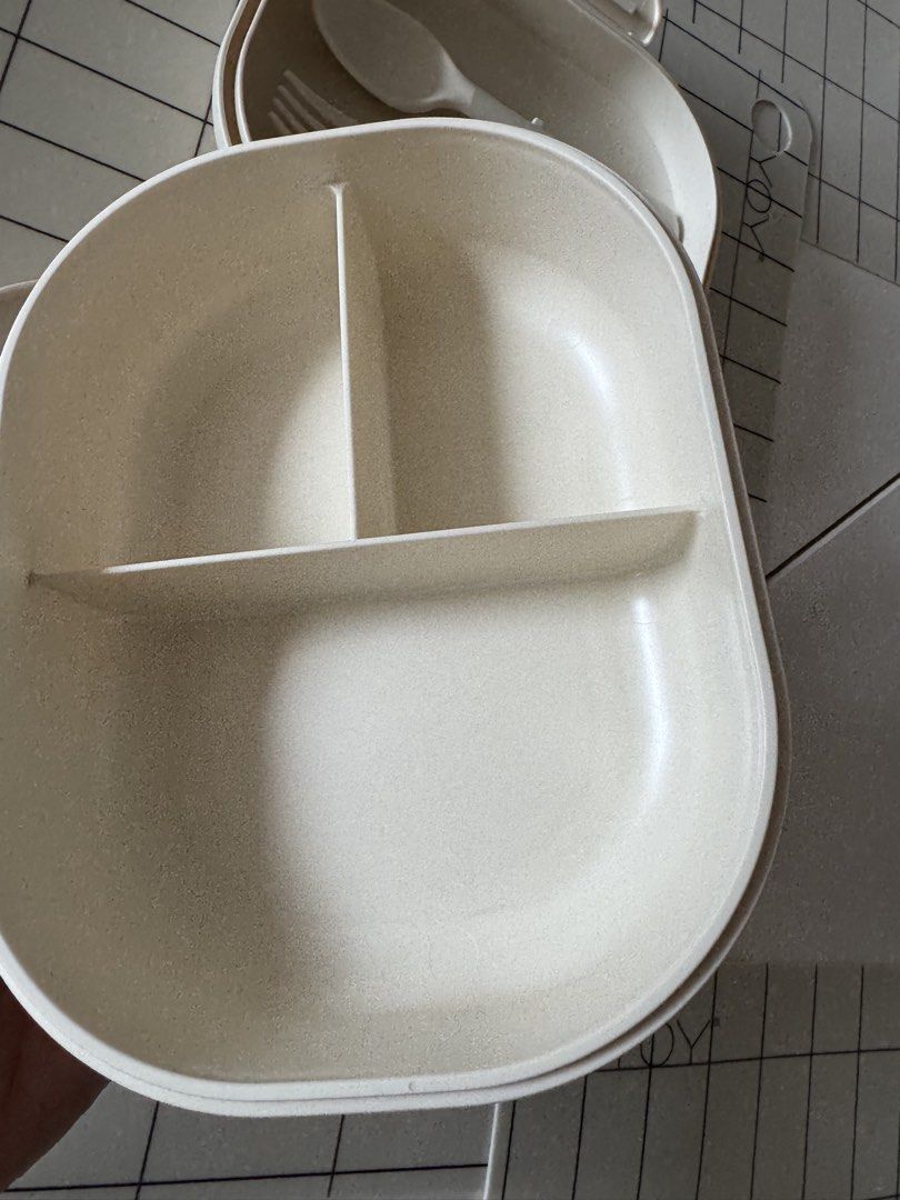 Preloved Mushie Bento Box with Fork and Spoon (Category: Food Organization & Storage) located in Manila. Submitted by helloseptembermnl (Listing ID 1467364615, Image 3). Description: - Authentic Mushie Lunch Box (Made in Denmark) - Color: Cream - Includes matching spoon and fork that securely clip into the lid - 3 divided compartments to keep foods separate - Microwave safe up to 100°C (for reheating only, not cooking) - Practical bento-style des