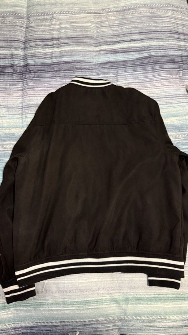 Pull & Bear Varsity Academy Black Jacket Size XL (Category: Coats, Jackets and Outerwear) located in Quezon City. Submitted by kobeeeee_12 (Listing ID 1467529413, Image 2). Description: - Brand: Pull & Bear - Style: Varsity jacket - Color: Black with white embroidery ('Varsity Academy' on left chest) - Size: XL - Closure: Snap buttons down the front - Details: Striped ribbed collar, cuffs, and hem, plus two front welt pockets - Origin: Made in My