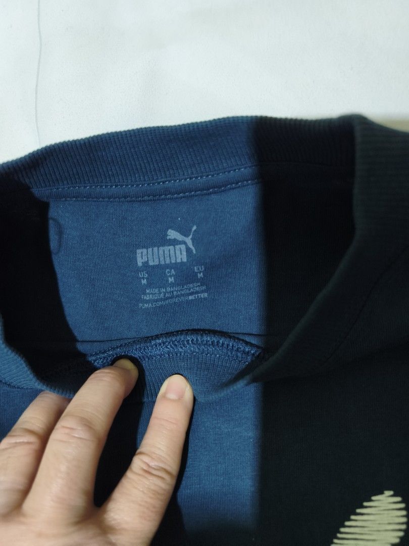Puma Blue Graphic T-shirt Size M (Category: Shirts) located in Quezon City. Submitted by tintinarms (Listing ID 1467526641, Image 3). Description: - Brand: Puma ladies - Color: Blue with white sketched graphic logo - Size: Medium (Regular fit) - Material: 100% Cotton (Soft and comfortable feel) - Design: Crew neck, short sleeves - bust size - 19 inches.