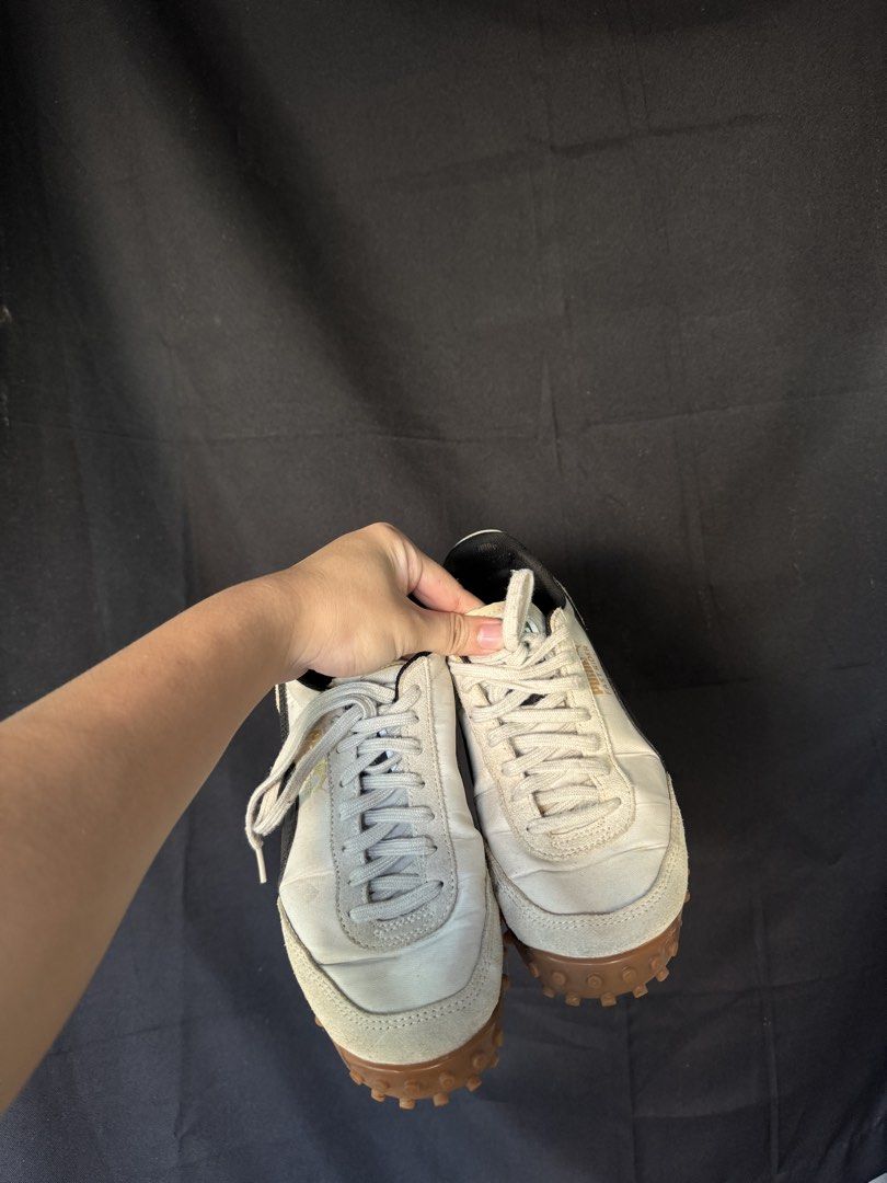 Puma Fast Rider Sneakers (Category: Sneakers) located in Manila. Submitted by meegy (Listing ID 1467440300, Image 2). Description: - Brand: Puma Fast Rider -unworn - Colorway: Cream, white, and black - Material: Fabric upper with suede panels on the toe and heel - Sole: Textured gum rubber outsole with prominent studded treads - Closure: Standard lace-up front - Condition: Clean, ready-to-wear condition with minimal wear on the soles.