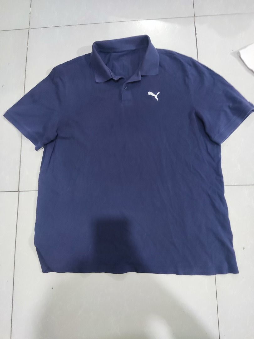 Puma Navy Blue Polo Shirt (Category: Tshirts & Polo Shirts ) located in Rizal. Submitted by skilidilidu (Listing ID 1467548069, Image 1). Description: - Brand: Puma - Color: Navy Blue - Style: Classic collar with button placket - Logo: White embroidered logo on the chest - Origin: Made in Bangladesh - Condition: Clean inside and out, comfortable for everyday wear.