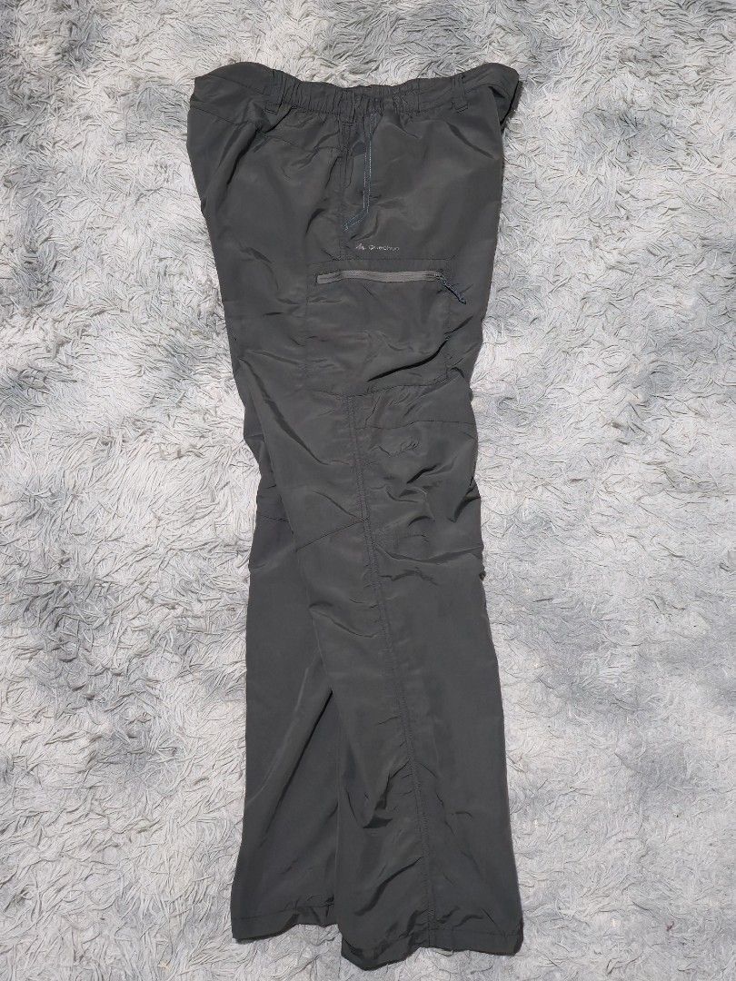 Quechua Hiking Trekking Pants Charcoal Grey (Category: Trousers) located in Abulug. Submitted by humanwhosellthings (Listing ID 1467366603, Image 2). Description: DECATHLÒN QUECHUA Hiking Pants ✅Excellent Condition ✅Issue: none ▫️Waist Size: 34-38 ▫️Length: 42 - Color: Charcoal grey - Fit: Straight leg with elastic waistband and belt loops - Storage: Zippered thigh pocket with printed logo - Material: Lightweight synthetic - Condition: Clean, no 