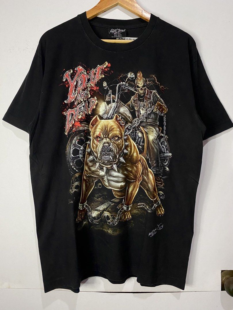 RACKCHANG TSHIRT GLOW IN THE DARK (Category: Tshirts & Polo Shirts ) located in Jaen. Submitted by oshimamark58418 (Listing ID 1467533484, Image 1). Description: - Brand: RACKCHANG - Size: XL - Color: Black - Design: Bold graphic print featuring a chained pitbull, motorcycle rider, skulls, and 'You Are Dead' lettering with glow-in-the-dark details - Condition: Excellent pre-loved condition - Style: Edgy streetwear / Rock graphic tee.