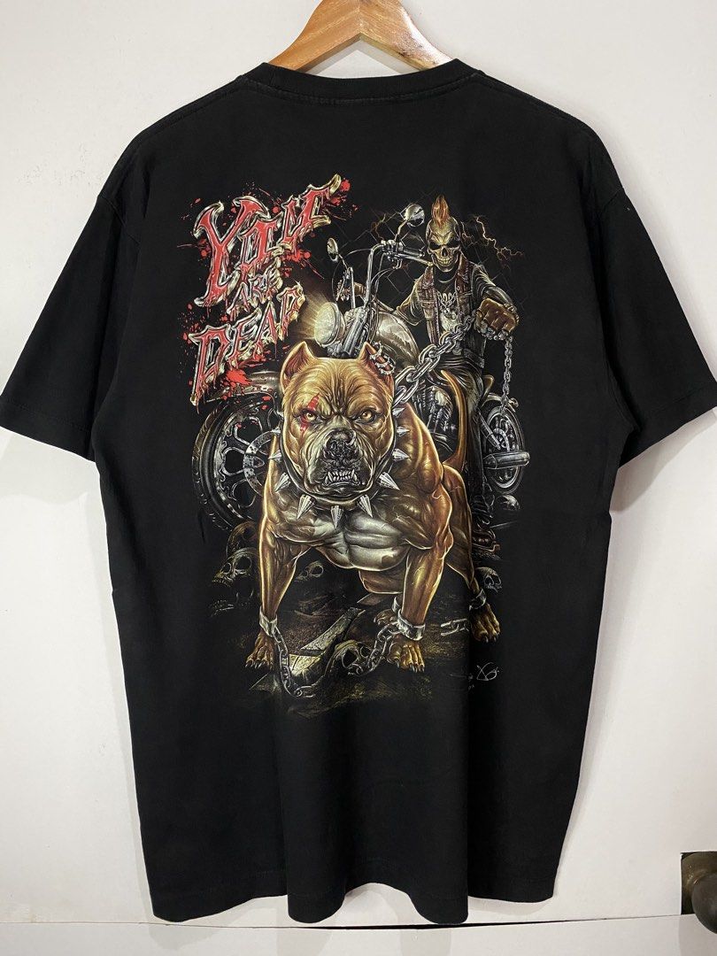 RACKCHANG TSHIRT GLOW IN THE DARK (Category: Tshirts & Polo Shirts ) located in Jaen. Submitted by oshimamark58418 (Listing ID 1467533484, Image 2). Description: - Brand: RACKCHANG - Size: XL - Color: Black - Design: Bold graphic print featuring a chained pitbull, motorcycle rider, skulls, and 'You Are Dead' lettering with glow-in-the-dark details - Condition: Excellent pre-loved condition - Style: Edgy streetwear / Rock graphic tee.