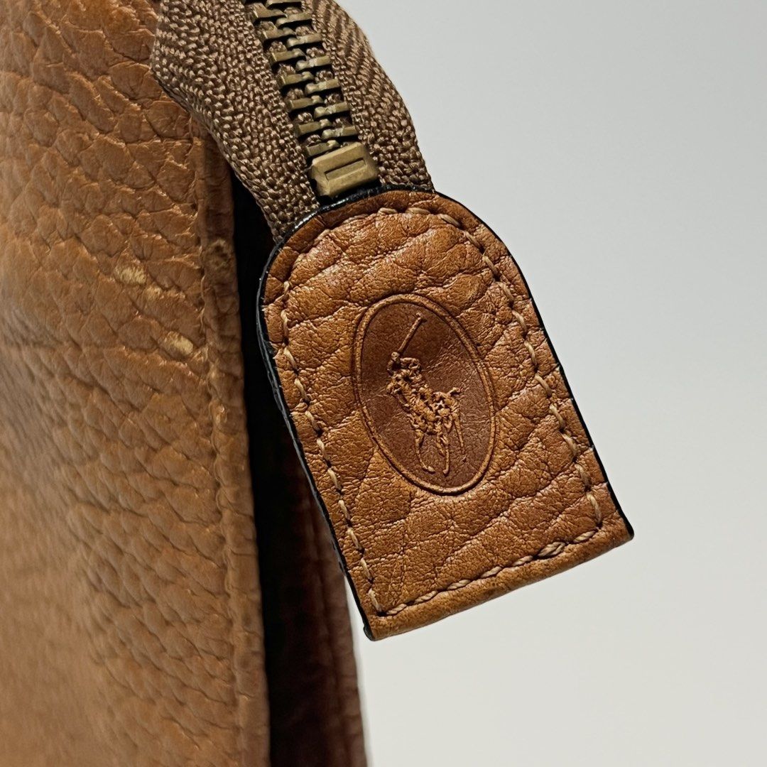 Ralph Lauren Clutch Bag (Category: Belt bags, Clutches and Pouches) located in San Pedro. Submitted by strt.manila (Listing ID 1467591267, Image 2). Description: Ralph Lauren Clutch Bag Dual Zipper inside Minor scratches on the side (can provide photos) Minor ballpen stain inside.