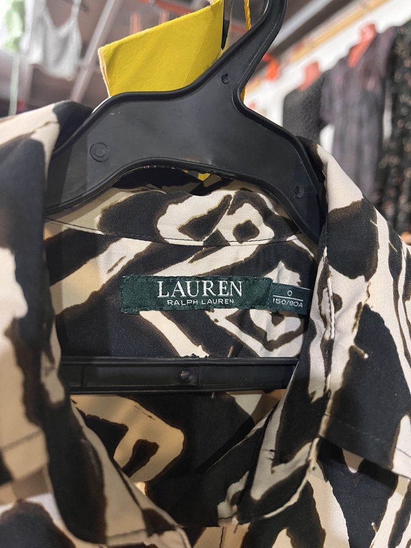 Ralph Lauren Geometric Diamond Print (Category: Dresses) located in Valencia. Submitted by hunterxthrifter (Listing ID 1467379331, Image 2). Description: • Black & beige geometric pattern • Button-up front with collar • Long sleeves with button cuffs • Two front flap pockets • 100% polyester • Made in China • Size: 150/80A .