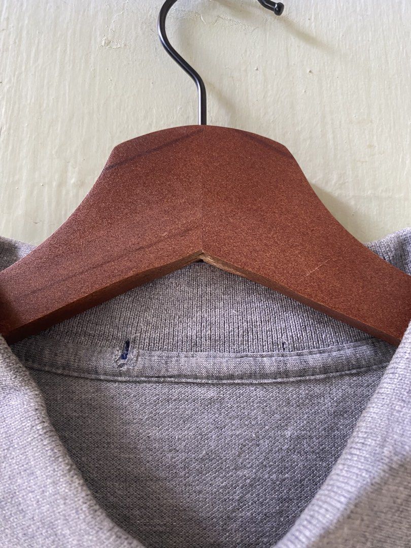 Ralph Lauren Grey Polo Shirt (Category: Tshirts & Polo Shirts ) located in Pandi. Submitted by nasya_thrift_collection2023 (Listing ID 1467413697, Image 3). Description: - Brand: Ralph Lauren - Color: Grey - Material: 100% Cotton (Made in China) - Features: Short sleeves, classic collar with 2 buttons, signature red embroidered pony logo on the chest - Condition: Clean fabric throughout, excellent pre-loved condition.