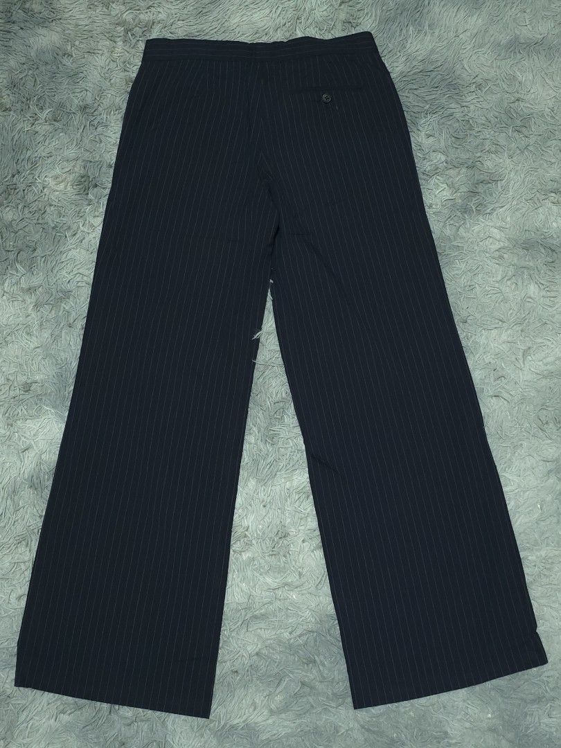 Ralph Lauren Pinstripe Pants (Category: Trousers) located in Abulug. Submitted by humanwhosellthings (Listing ID 1467365269, Image 1). Description: - Brand: Ralph Lauren Womens Trousers ✅Excellent Condition ✅Issue: none ▫️Waist Size: 30 ▫️Length: 40 - Color: Dark navy blue with classic vertical pinstripes - Size: Tagged size 9 - Fit: Tailored fit with a structured waistband - Features: Smooth fabric feel and a convenient rear pocket with button c