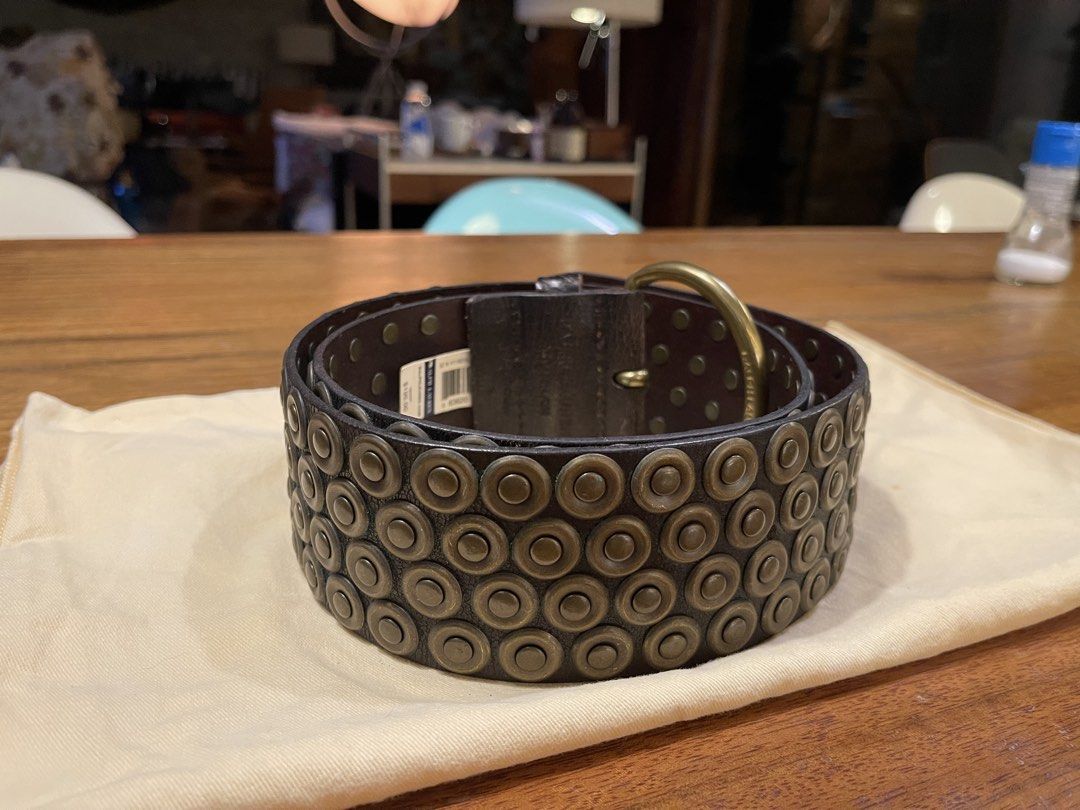 Ralph Lauren Studded Leather Belt (Category: Belts) located in Quezon City. Submitted by vaugncruz08 (Listing ID 1467589224, Image 1). Description: - Color: Dark brown leather - Details: Multiple rows of round brass-toned studs with dark metal grommets - Hardware: Heavy buckle design and substantial hardware - Condition: Brand new, tag attached, never worn - Negotiable.
