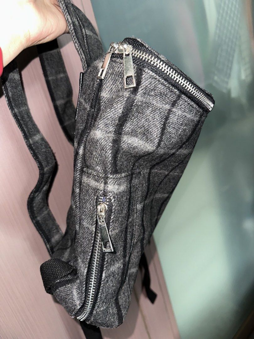 Rare Ciaopanic Typy Plaid Backpack Grey (Category: Backpacks) located in Mandaluyong City. Submitted by TheWeekendProject (Listing ID 1467424519, Image 2). Description: - Brand: Ciaopanic Typy - Design: Grey and black plaid pattern with a wool-like texture - Pockets: Smooth silver zippers on the top opening and front pocket - Straps: Adjustable shoulder straps with durable black webbing - Interior: Clean blue fabric lining with an inner pocket an