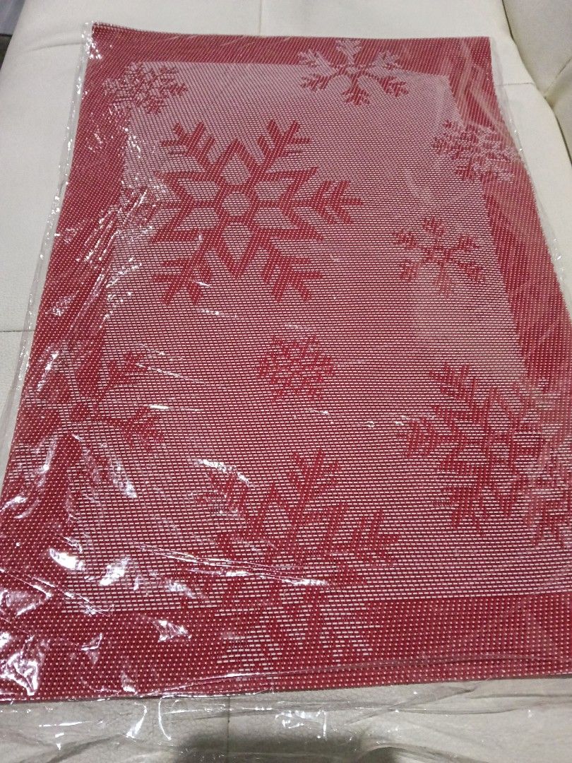 Red Christmas Snowflake Placemat Table Mat (Category: Table Linen & Textiles) located in Manila. Submitted by zenbear_6b2d8a (Listing ID 1467387874, Image 2). Description: - Festive red snowflake design perfect for Christmas - Durable woven texture with a solid red border - Brand new, comes in clear plastic wrapping - Ideal for holiday table settings and family dinners.
