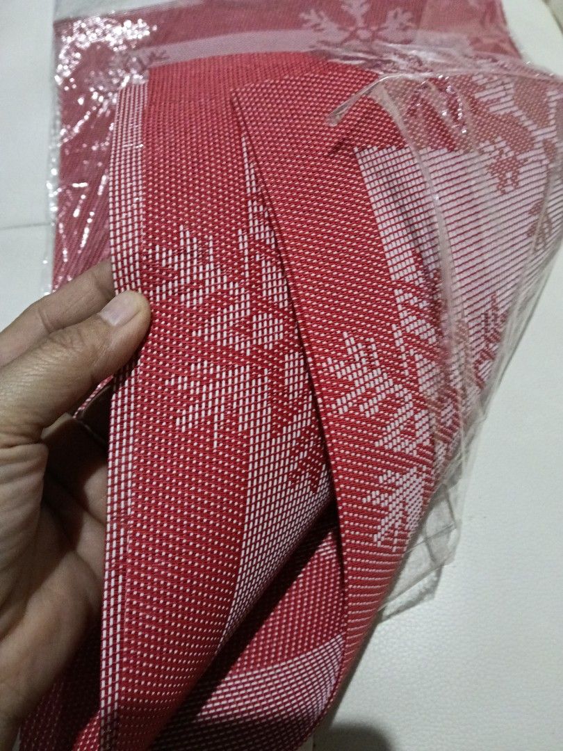 Red Christmas Snowflake Placemat Table Mat (Category: Table Linen & Textiles) located in Manila. Submitted by zenbear_6b2d8a (Listing ID 1467387874, Image 3). Description: - Festive red snowflake design perfect for Christmas - Durable woven texture with a solid red border - Brand new, comes in clear plastic wrapping - Ideal for holiday table settings and family dinners.