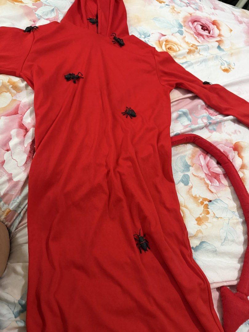 Red Devil (Category: Babies & Kids Fashion) located in Manila. Submitted by fitandshop (Listing ID 1467444840, Image 3). Description: - Vibrant red hooded devil costume for kids - Features built-in devil horns and a matching tail - Decorated with fun and spooky black insect accents all over - Soft and comfortable material suitable for parties, meetups, or Halloween events - Ready stock and fast shipping available - pakitahi nlng ng horn.