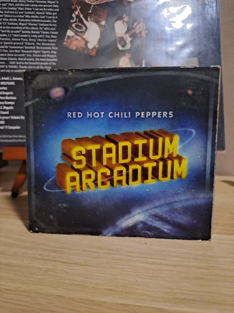 Red Hot Chili Peppers Stadium Arcadium CD (Category: CDs & DVDs) located in Las Pinas. Submitted by cobieshop (Listing ID 1467498604, Image 1). Description: Red Hot Chili Peppers double album Stadium Arcadium. Includes two discs covering Jupiter and Mars tracks. Jewel case shows some edge wear and scuffs from storage. Full tracklist printed on the back cover with band member photos..
