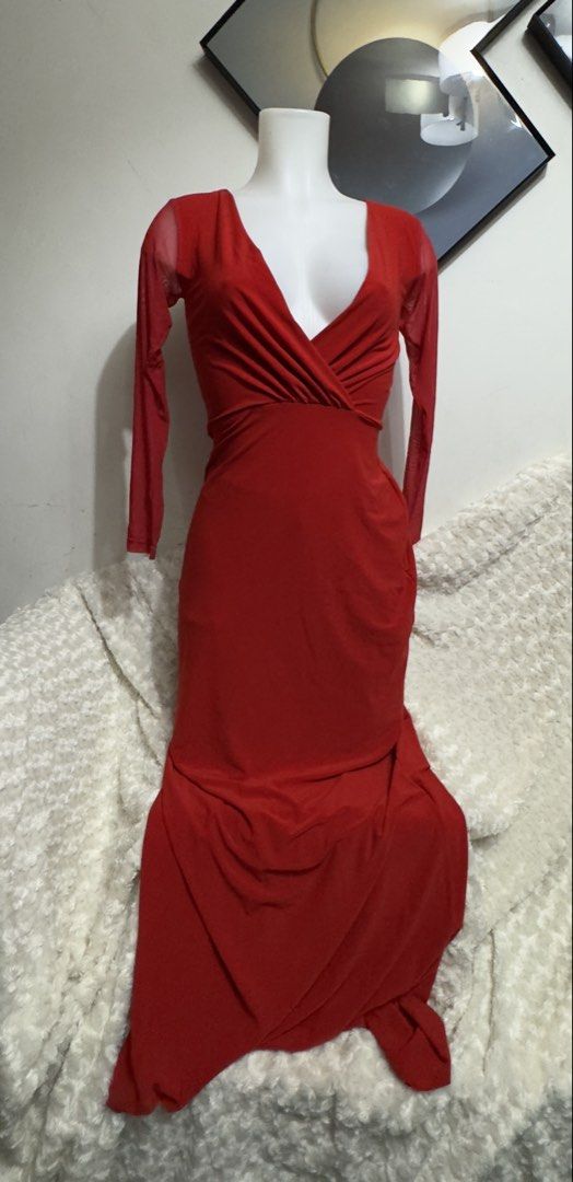 Red long sleeve maxi dress (Category: Dresses) located in Marikina City. Submitted by lorradel (Listing ID 1467508498, Image 1). Description: - Color: Bright red - Design: Sheer mesh sleeves with deep V-neckline and gathered crossover wrap bodice - Fit: Fitted waist with a draped floor-length skirt and slight flare - Back: Solid red fabric with a smooth, zip-free slip-on fit - Occasion: Ideal for evening parties, balls, and formal events - MAY HA