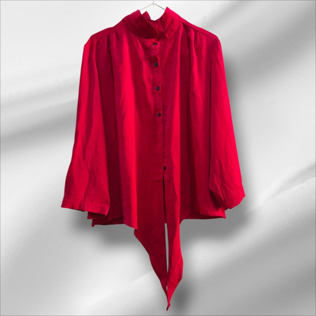 Red polo Long Sleeve Button Down Blouse with Tie Hem (Category: Blouses) located in Taguig. Submitted by deyerreC2020 (Listing ID 1467459159, Image 3). Description: nice blouse malamig sa skin,flowy good quality polyester fabric, like new bust : 46 crimson red long-sleeve blouse featuring a high collar, button-down front with black buttons, and a stylish front-tie knot. for formal work,casual wear., Lightweight and versatile for layering or stand