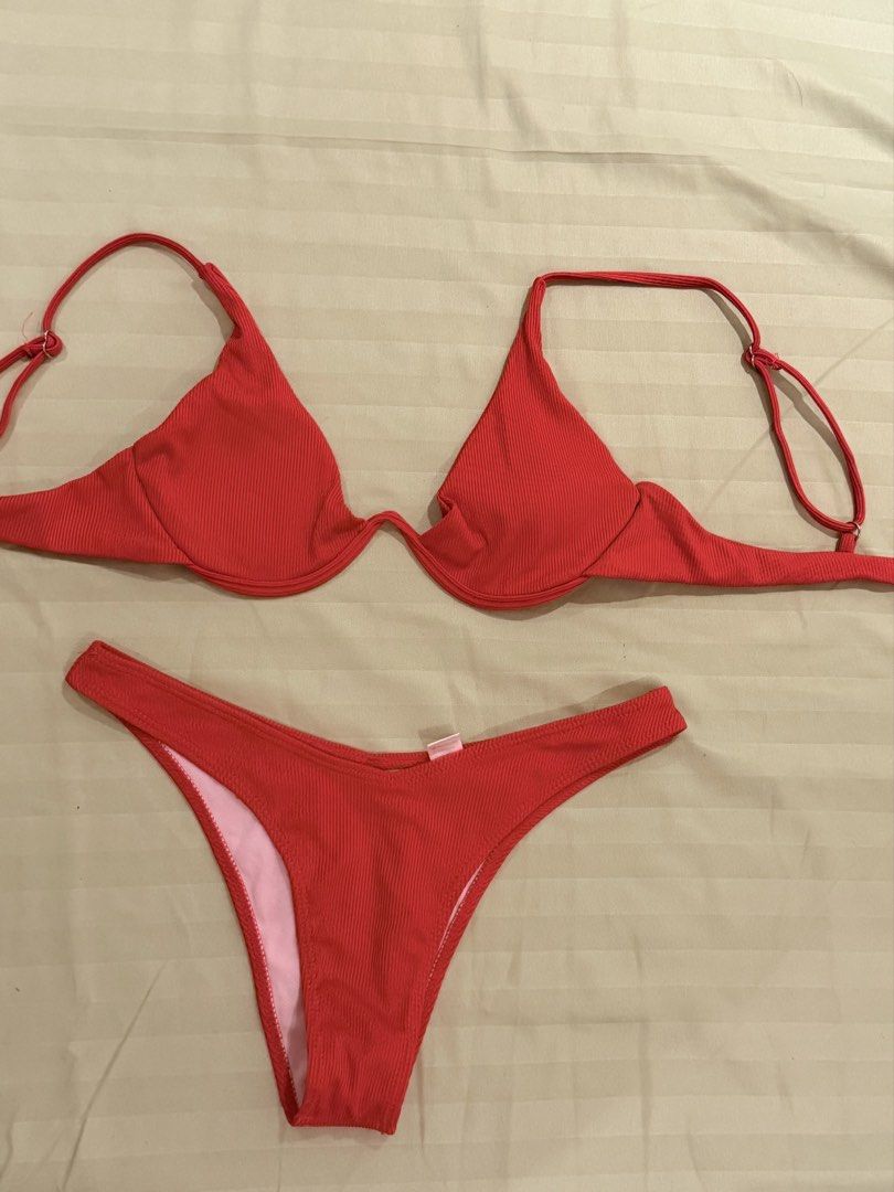 Red Ribbed Underwire Bikini Set Two Piece Swimwear (Category: Bikinis & Swimsuits) located in Quezon City. Submitted by caathhx_ (Listing ID 1467510067, Image 1). Description: - Color: Bright red with cute pink inner lining - Texture: Trendy ribbed fabric throughout - Top: Underwire support with adjustable shoulder straps - Bottom: Cheeky cut for a flattering fit - Condition: Like new, clean with no flaws or loose threads - Ideal for: Beach days,