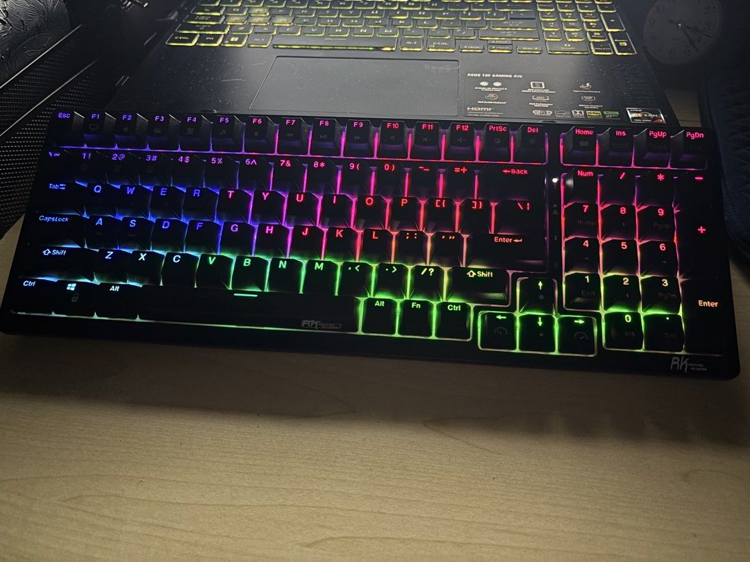 RK Royal Kludge RK98 Mechanical Wireless Keyboard (Category: Computer Keyboard) located in Taguig. Submitted by remodeatelier (Listing ID 1467488898, Image 1). Description: - Model: RK98 Mechanical Wireless Keyboard (Black) - Lighting: Vibrant RGB backlight - Layout: Space-saving 98-key layout with complete number pad - Features: Hot-swappable switches, built-in slot for wireless receiver - Condition: Fully tested and working great - Inclusions: 