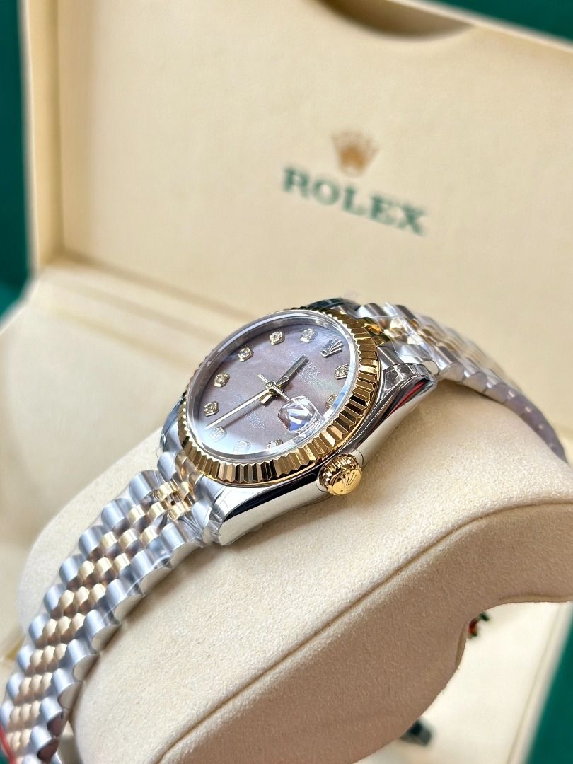 Rolex Datejust Two-Tone Diamond Dial Watch with Box (Category: Luxury Watches) located in Navotas City. Submitted by stevensmit50068 (Listing ID 1467438296, Image 3). Description: - Model: Rolex Datejust Two-Tone (Yellow Gold & Steel) - Bracelet: Jubilee bracelet with original protective plastic film still wrapped - Bezel: Iconic fluted yellow gold bezel - Dial: Brown sunburst or mother-of-pearl set with sparkling diamond hour markers - Crystal: 