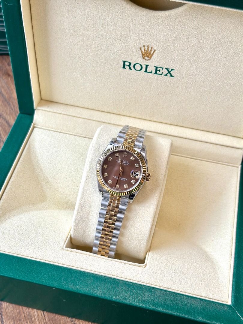 Rolex Datejust Two-Tone Diamond Dial Watch with Box (Category: Luxury Watches) located in Navotas City. Submitted by stevensmit50068 (Listing ID 1467438296, Image 1). Description: - Model: Rolex Datejust Two-Tone (Yellow Gold & Steel) - Bracelet: Jubilee bracelet with original protective plastic film still wrapped - Bezel: Iconic fluted yellow gold bezel - Dial: Brown sunburst or mother-of-pearl set with sparkling diamond hour markers - Crystal: 