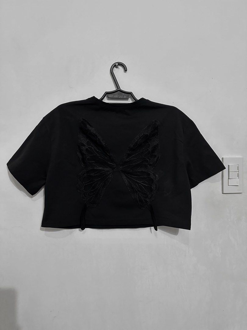 ROMWE Black Butterfly Crop Top (Category: Sleeveless) located in San Jose. Submitted by kuppa.koffee (Listing ID 1467486623, Image 1). Description: I have more clothes up for sale as I declutter my closet! Feel free to check out my profile for more. 🤍 Crop Top Details 🦇 • front: plain black shirt • back: butterfly see-through mesh • can be worn by S-XL body frame • worn once, washed, ready to wear 📦 RFS: wardrobe overhaul 📸 can take photos up