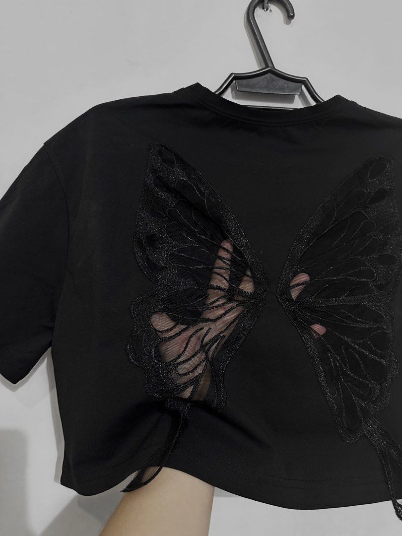ROMWE Black Butterfly Crop Top (Category: Sleeveless) located in San Jose. Submitted by kuppa.koffee (Listing ID 1467486623, Image 3). Description: I have more clothes up for sale as I declutter my closet! Feel free to check out my profile for more. 🤍 Crop Top Details 🦇 • front: plain black shirt • back: butterfly see-through mesh • can be worn by S-XL body frame • worn once, washed, ready to wear 📦 RFS: wardrobe overhaul 📸 can take photos up