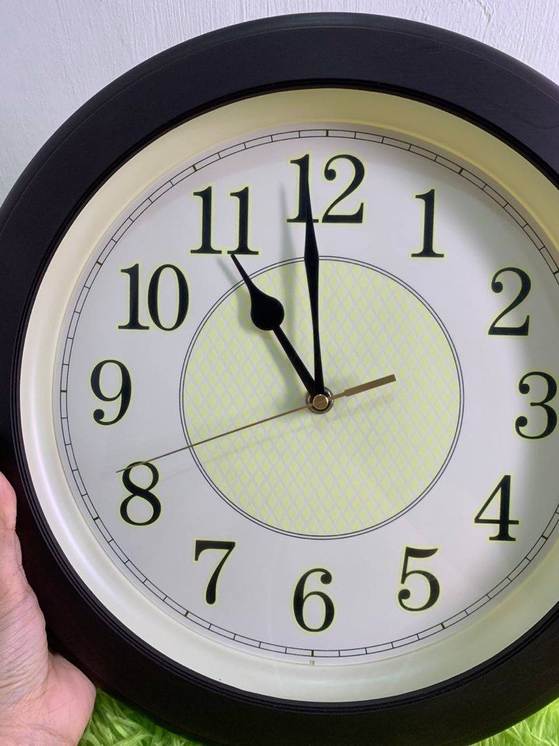 Round Wall Clock – Black Frame with Large Numbers (Category: Clocks) located in Manila. Submitted by nicanicss (Listing ID 1467386668, Image 3). Description: Round Wall Clock – Black Frame with Large Numbers Description: For sale: Round wall clock with a black frame, cream-colored dial, and large, easy-to-read numbers. Simple and classic design, perfect for your home, office, or room. Working Condition Price: ₱450.