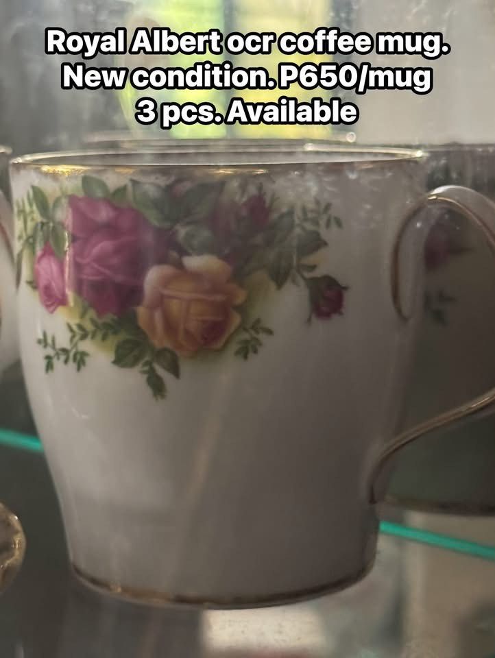 Royal Albert Coffee Mug (Category: Coffee & Tea Tableware) located in Cainta. Submitted by elainelawenko (Listing ID 1467447222, Image 1). Description: - Authentic Royal Albert coffee mug - Classic floral rose pattern with pink, red, and yellow roses - Elegant gold trim and gold-accented handle - Premium white ceramic body - Price: ₱650 each - Quantity: 3 pieces available (sold individually).
