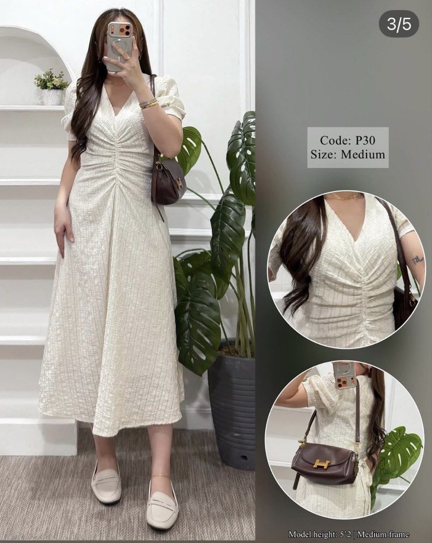 Ruched Midi Dress Cream Size Medium (Category: Dresses) located in Paranaque City. Submitted by khamsay (Listing ID 1467374764, Image 1). Description: - Color: Cream - Style: Midi dress with a flattering fit-and-flare silhouette - Material: Textured crinkle fabric - Details: V-neckline, ruched center drawstring front, short puffed sleeves - Size: Medium (Tagged) - Model Reference: 5'2" tall with a medium frame.