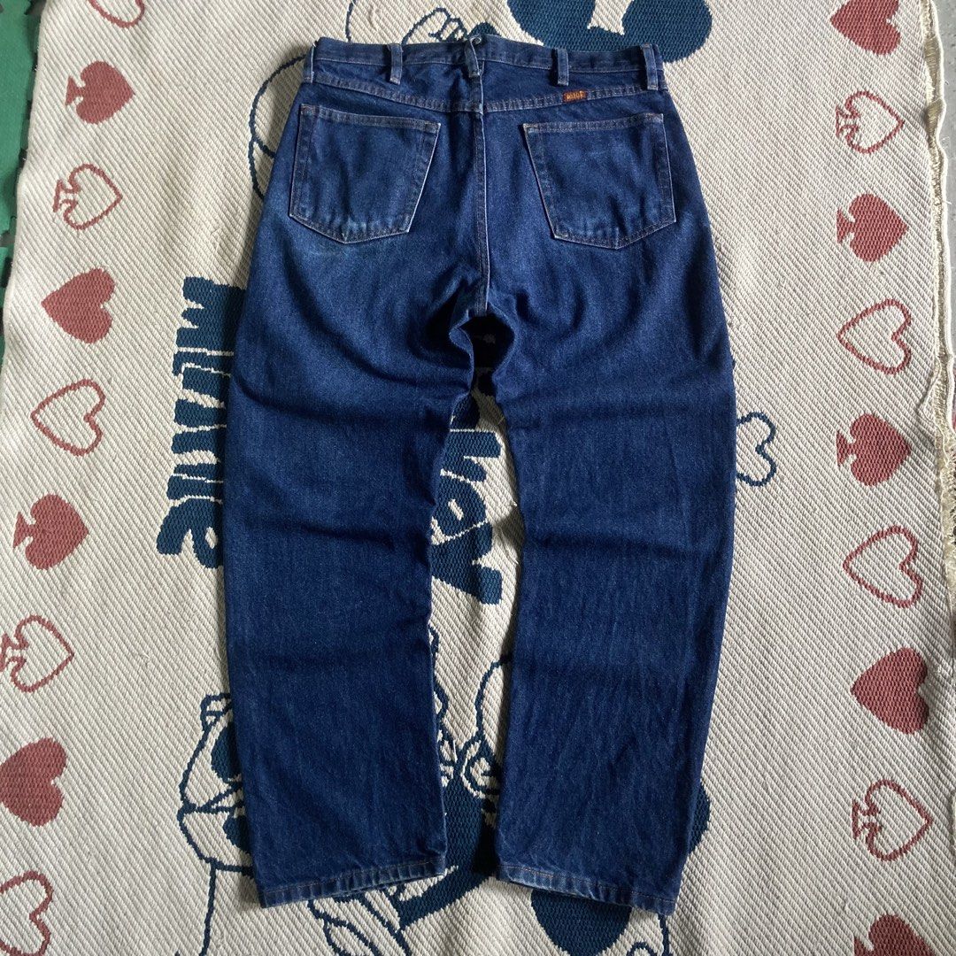 Rustler Dark Wash Denim Jeans (Category: Jeans) located in Tanay. Submitted by marvinbendania (Listing ID 1467368901, Image 2). Description: - Brand: Rustler - Wash: Dark wash denim - Fit: Standard sizing, traditional straight leg cut - Details: Classic five-pocket design, branded button closure, back pocket patch - Material: Sturdy, heavy-duty denim construction - Style: Timeless vintage everyday staple.