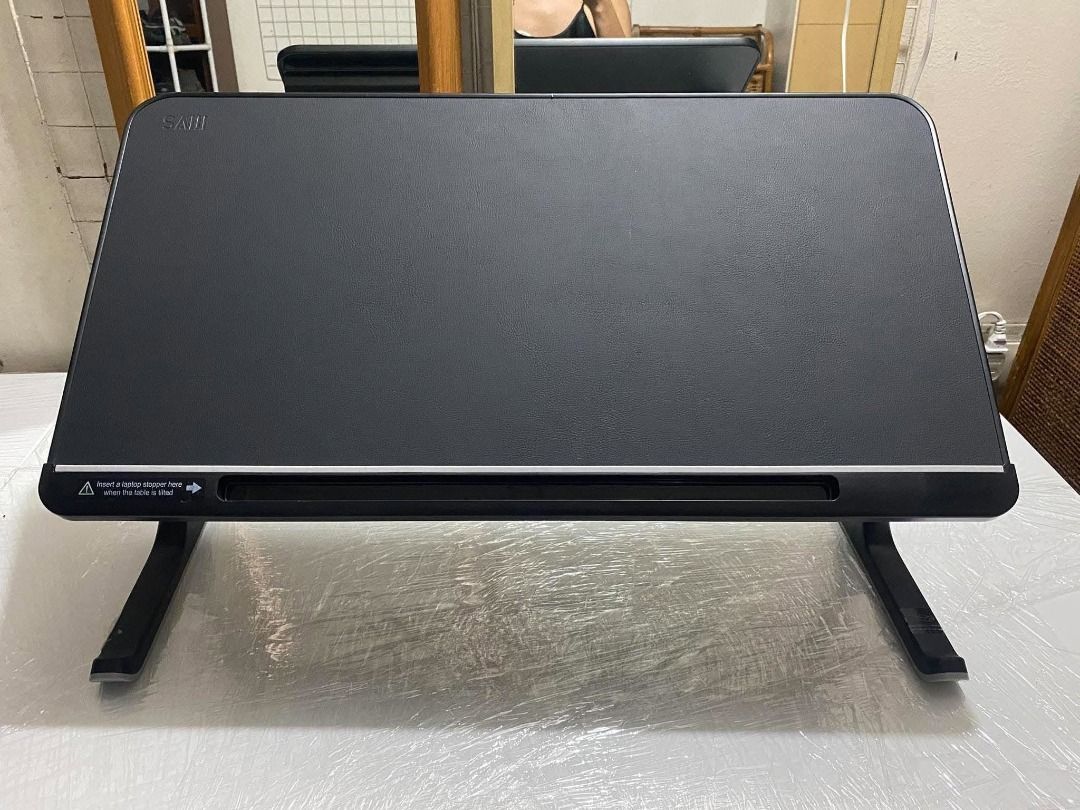 SAIJI Foldable Laptop (Category: Office Furniture & Fixtures) located in Cavite. Submitted by maisonmem (Listing ID 1467493647, Image 3). Description: ✅ Adjustable / Tilted Table top ✅ Foldable space saver ✅ Leather finish - premium look ✅ Good as new, quality from Japan ✅ Multi-purpose Limited stock only!!! .