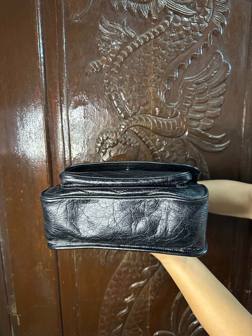 Saint Laurent College Monogram Chain Bag Black (Category: Luxury Bags & Wallets) located in Manila. Submitted by jxmievicto12443 (Listing ID 1467490652, Image 3). Description: - Brand: Saint Laurent College Bag - Material: Black crinkled leather with silver-tone hardware - Hardware: Iconic YSL front monogram - Closure: Magnetic snap closure - Interior: Fabric lining with zip pocket - Exterior: Convenient slip pocket on the back - Origin: Made in 