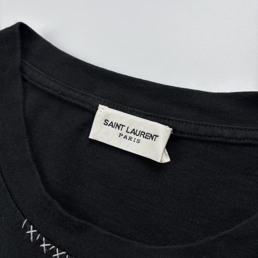 Saint Laurent Heart Tshirt (Category: Luxury Apparel) located in Bacolod City. Submitted by cast.archives (Listing ID 1467571113, Image 3). Description: Saint Laurent Heart Tshirt Size: Large Condition: Very good Flaw: Sign of used.