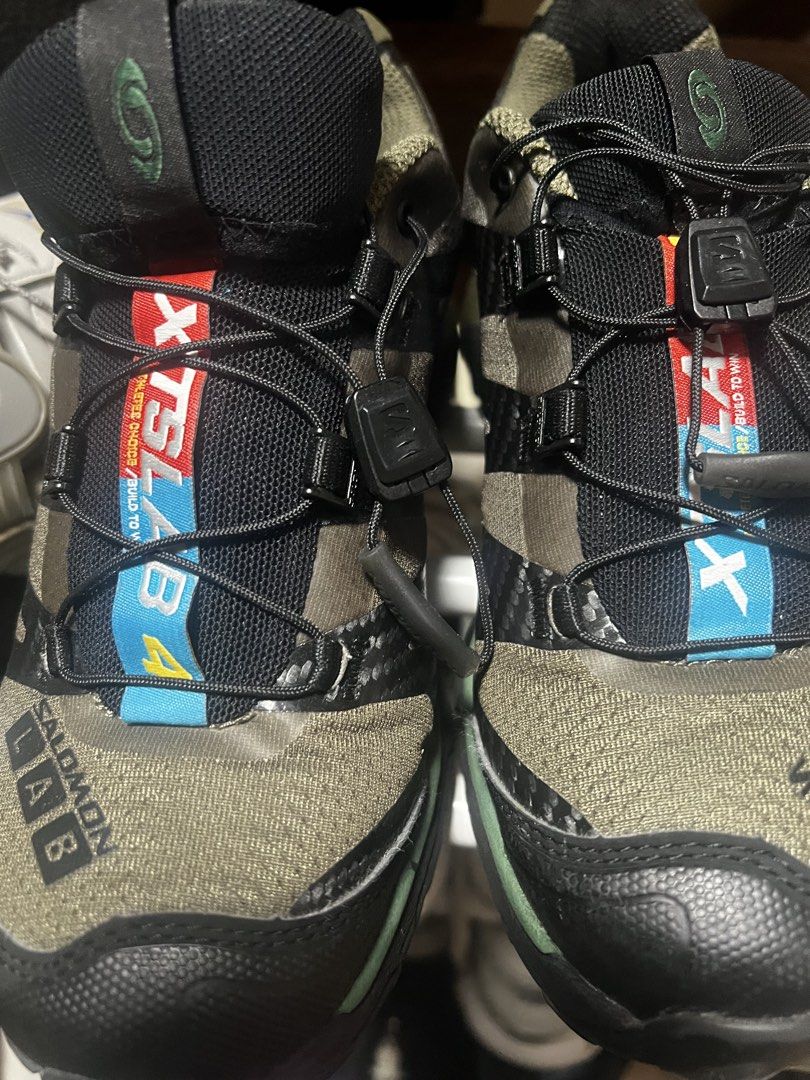 Salomon XT4 UK 4 (Category: Sneakers) located in Quezon City. Submitted by caelaillu (Listing ID 1467378946, Image 1). Description: - Brand: Salomon - Color: Olive green and black - Size: UK 4 - Features: Quicklace system with tongue lace pocket, S-Lab branding - Outsole: Contagrip rubber with deep lugs for superior trail grip.