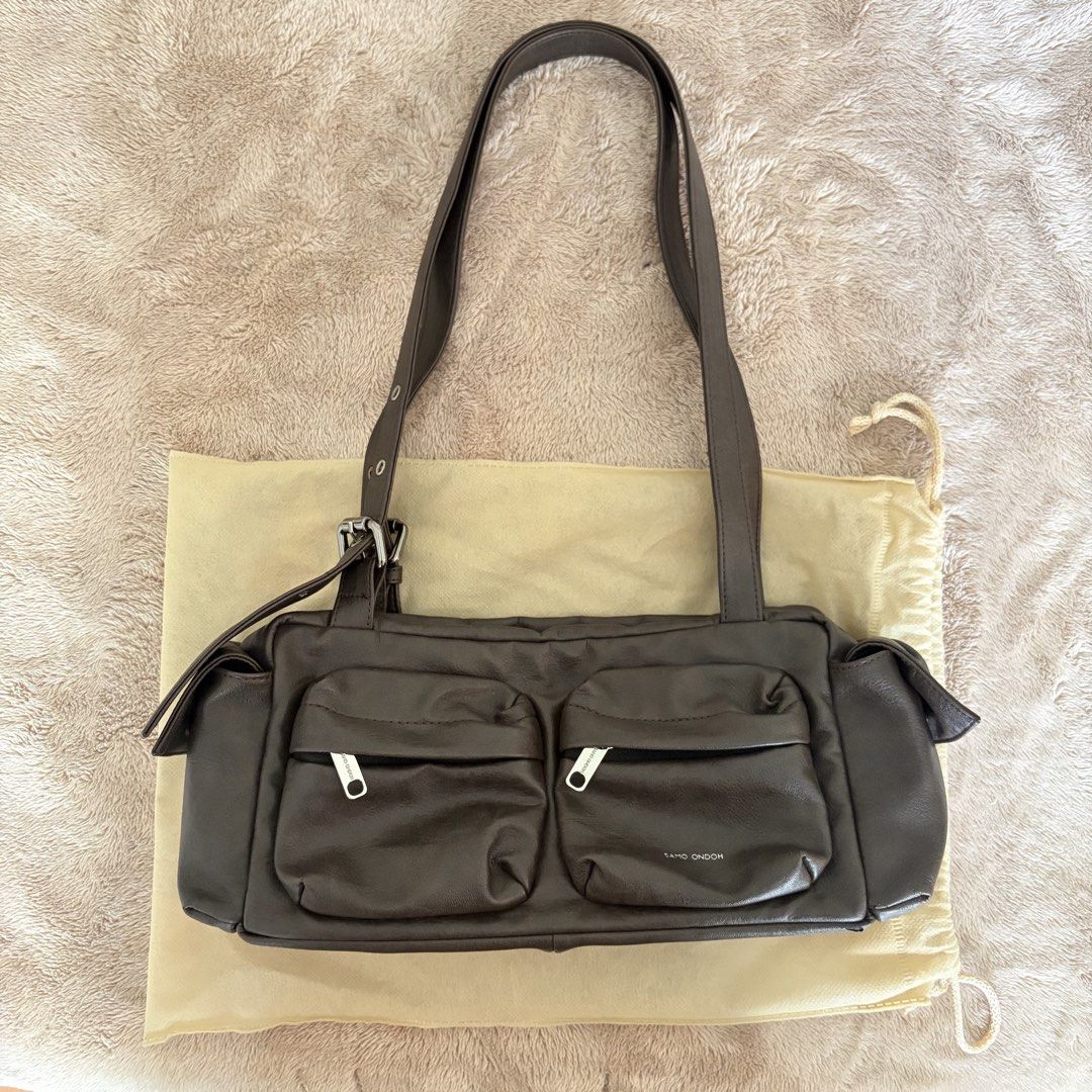 Samo Ondoh Pocket Utility Bag M (Category: Shoulder Bags) located in San Juan City. Submitted by _ands_ (Listing ID 1467465074, Image 1). Description: - Color: Brushed Chocolate - May have minimal signs of use (none that I can see, but please manage your expectations) - Storage bag included ❗️Flaw: strap keeper in the front got lost 🥲 (see last photo).