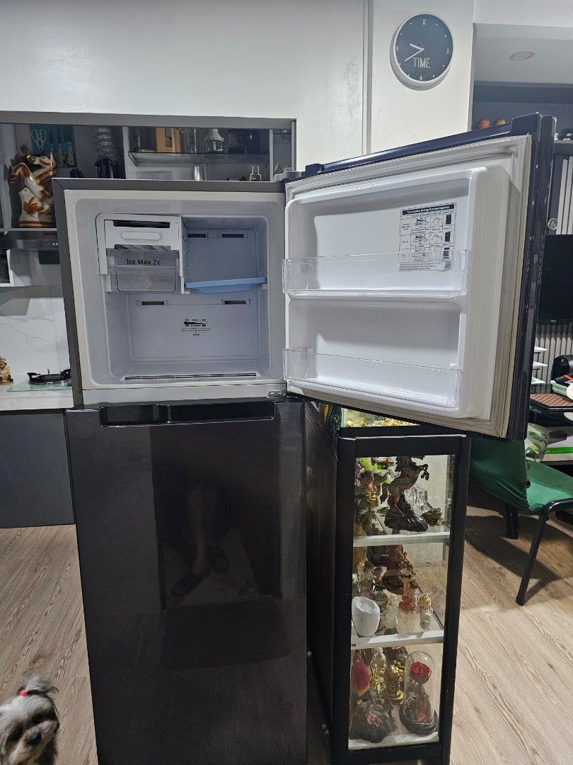 Samsung Double Door Refrigerator (Category: Refrigerators and Freezers) located in Caloocan City. Submitted by quickforest.014aad (Listing ID 1467371646, Image 3). Description: - Brand: Samsung Double Door Fridge - Finish: Dark brushed metal - Technology: Digital Inverter (quiet & energy-efficient) - Interior: Glass shelves, crisper drawer, and door bins - Freezer: Includes ice maker trays - Condition: Clean inside, excellent working condition - 