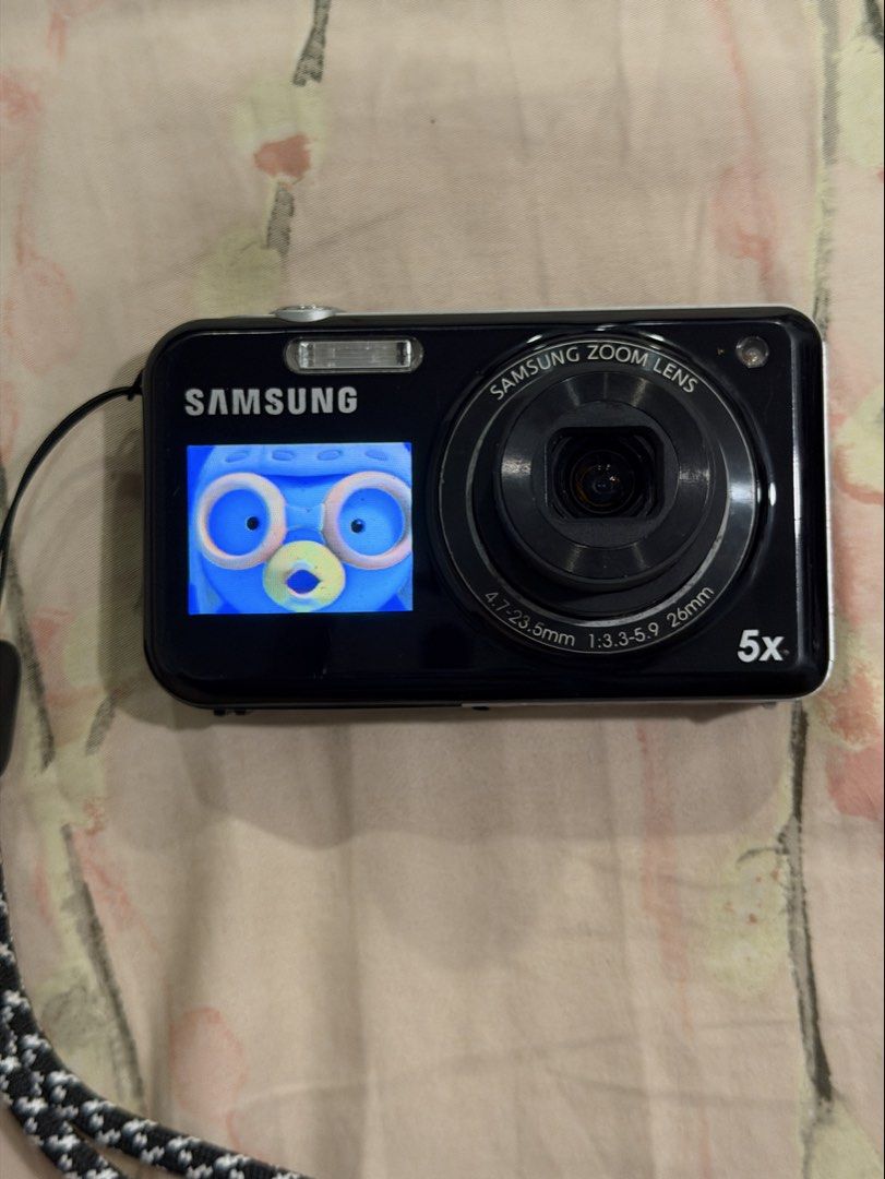 samsung pl120 digital camera dual screen digicam (Category: Cameras) located in Manila. Submitted by monchhichiluvr (Listing ID 1467552704, Image 3). Description: 📸 Samsung PL120 DualView Digital Camera (14.2 MP) ✨ Highlights: • 14.2 Megapixels CCD Sensor • 5x Optical Zoom (26mm wide lens) • Dual LCD Screens (2.7” Rear / 1.5” Front) • 720p HD Video Recording • Built-in Flash & Creative Shooting Modes 📌 Condition: • 8.5/10 •Light scratches on bo