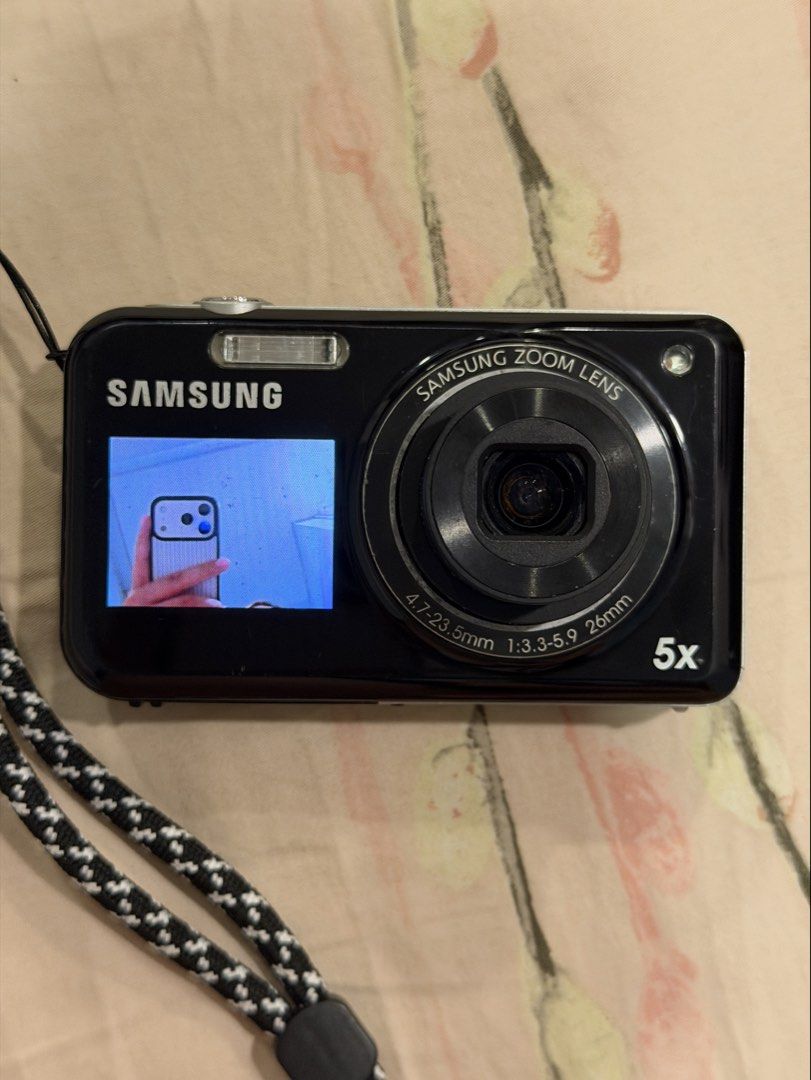 samsung pl120 digital camera dual screen digicam (Category: Cameras) located in Manila. Submitted by monchhichiluvr (Listing ID 1467552704, Image 1). Description: 📸 Samsung PL120 DualView Digital Camera (14.2 MP) ✨ Highlights: • 14.2 Megapixels CCD Sensor • 5x Optical Zoom (26mm wide lens) • Dual LCD Screens (2.7” Rear / 1.5” Front) • 720p HD Video Recording • Built-in Flash & Creative Shooting Modes 📌 Condition: • 8.5/10 •Light scratches on bo