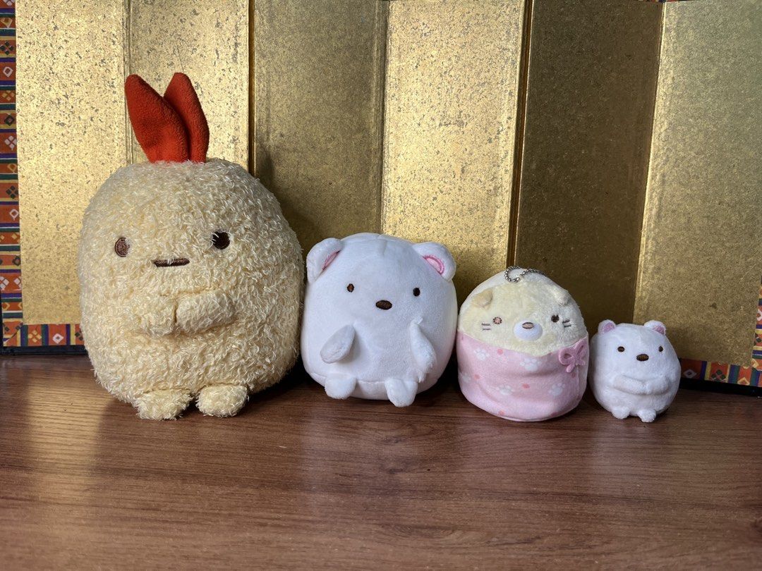 San X Sumikko Gurashi Plush Bundle Set (Category: Plushies & Soft Toys) located in Gapan. Submitted by lunashop14 (Listing ID 1467418767, Image 1). Description: - Official San-X merchandise with tags attached - 4-piece Sumikko Gurashi plush bundle - Includes large fried shrimp tail, medium white bear, small cat in pink paw pouch with ball chain, and tiny white bear - Made with super soft, high-quality fabric - Pristine condition with no flaws, pe