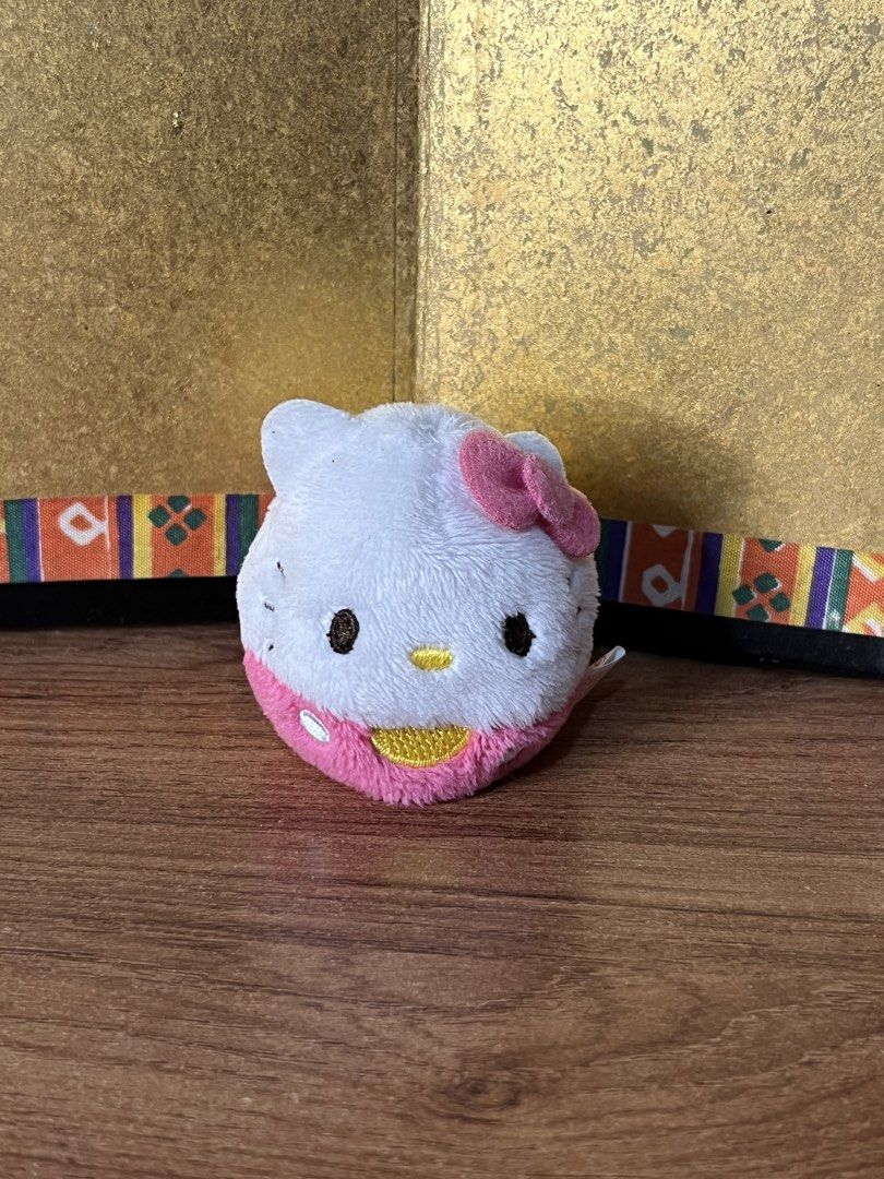 Sanrio Hello Kitty round plush pink and white (Category: Plushies & Soft Toys) located in Gapan. Submitted by lunashop14 (Listing ID 1467416048, Image 1). Description: - Authentic Sanrio Kitty round plush toy - Color: White top half, pink bottom half with golden embroidery - Features: Signature pink bow on the right ear and cute tail on the back - Authenticity: Official Sanrio license tag (dated 1976 and 2012) attached - Material: Ultra-soft and 