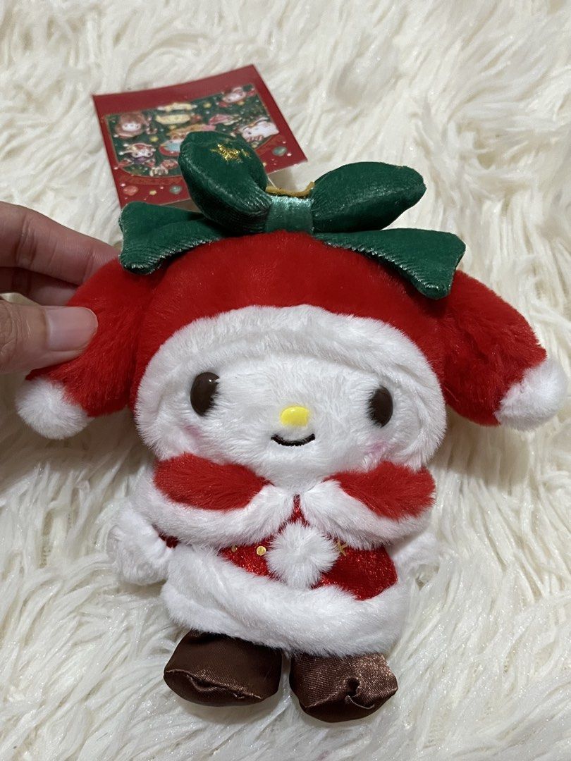 Sanrio My Melody Christmas Plush Keychain (Category: Plushies & Soft Toys) located in Bocaue. Submitted by silentcity (Listing ID 1467386607, Image 2). Description: - Official Sanrio My Melody holiday plush with original paper tag attached - Festive deep red Santa costume with white fluffy trim and cute brown shoes - Features a green velvet bow with gold star embroidery - Equipped with a gold bead chain for easy hanging on bags or keys - Excellen