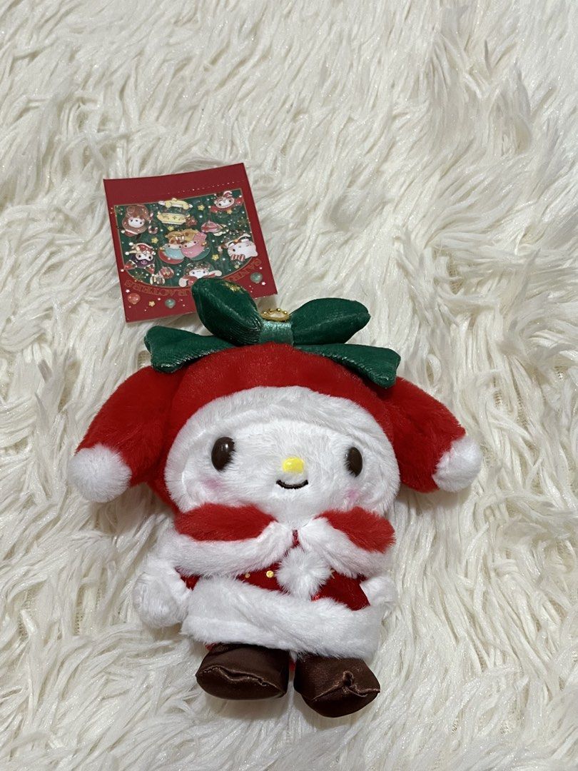 Sanrio My Melody Christmas Plush Keychain (Category: Plushies & Soft Toys) located in Bocaue. Submitted by silentcity (Listing ID 1467386607, Image 1). Description: - Official Sanrio My Melody holiday plush with original paper tag attached - Festive deep red Santa costume with white fluffy trim and cute brown shoes - Features a green velvet bow with gold star embroidery - Equipped with a gold bead chain for easy hanging on bags or keys - Excellen