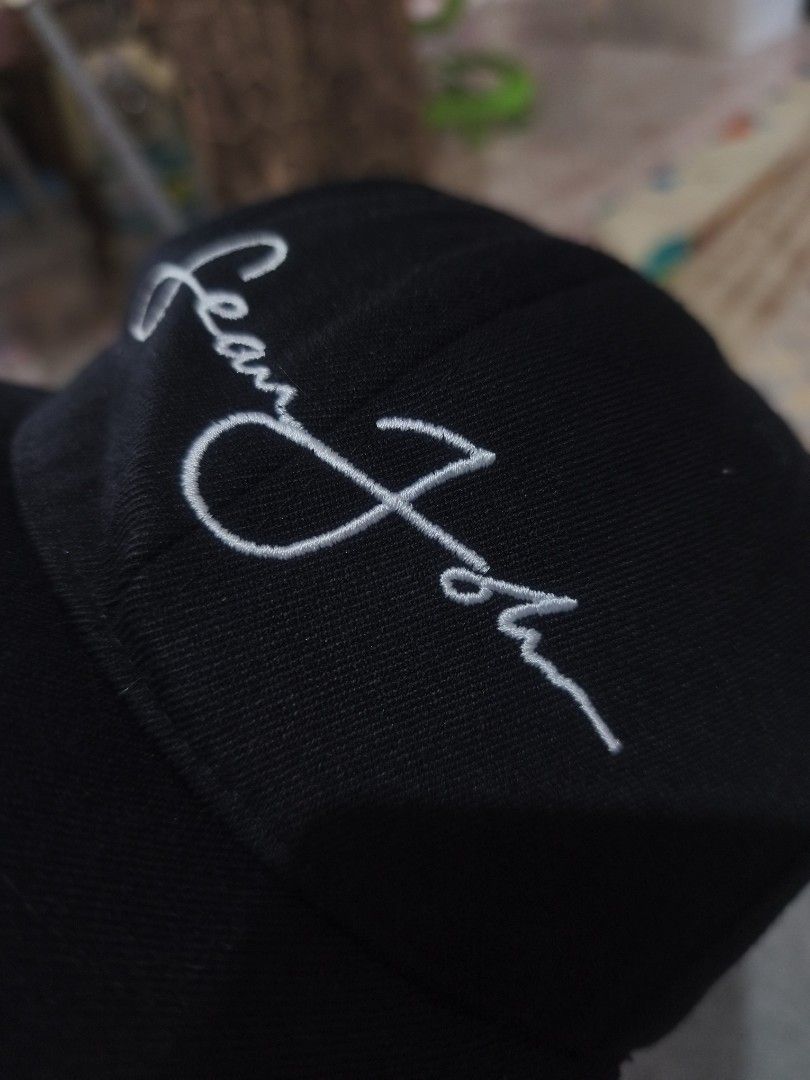 Sean John Flexfit Black Cap (Category: Caps & Hats) located in Cagayan de Oro. Submitted by elijah350below (Listing ID 1467516280, Image 2). Description: - Brand: Sean John - Color: Black with white embroidered script signature on front and small logo on back - Fit: Flexfit inner sweatband for a comfortable, snug fit - Material: 83% acrylic, 15% wool, 2% polyurethane spandex - Origin: Made in the Dominican Republic - Condition: good condition iss