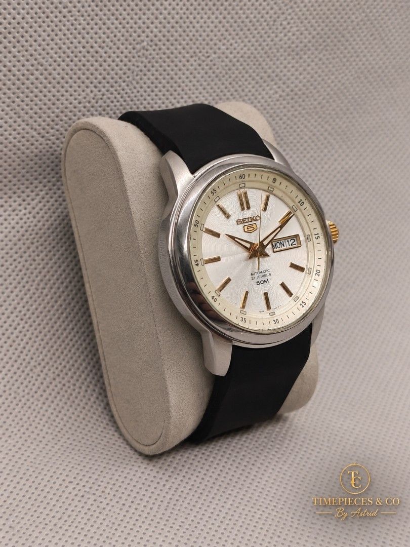 Seiko 5 Automatic SNKM83K1 (Category: Men's Watches) located in Pasig City. Submitted by timepiece-and-co (Listing ID 1467386410, Image 2). Description: Key Specifications: • Movement: Caliber 7S26 Automatic (self-winding mechanical movement with 21 jewels). • Case Size: Big size case measuring 43 mm in diameter. • Dial Details: Applied gold-tone indices, matching hands, a distinctive textured centerpiece, and a day-date display window located at