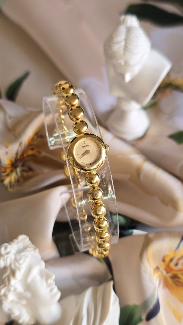 Seiko Bubbles (Category: Women's Watches) located in Silang. Submitted by thewornhour (Listing ID 1467480693, Image 2). Description: Vintage 1986 Seiko Quartz Dress Watch – Gold Ball-Link Chain Bracelet Accent ✔ All original watch ✔ Case: 10.6mm including crown ✔ Up to 16cm ✔ Movement: Seiko Japan Analogue Quartz ✔ Condition: An absolute stunner from Seiko's premium vintage era. There are minimal hairline scratches on the glass and some gold fadi