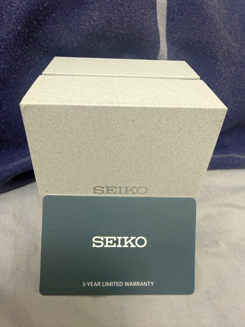 Seiko Chronograph Tachymeter Watch with Original Box (Category: Men's Watches) located in Valenzuela. Submitted by mannylucas26 (Listing ID 1467484694, Image 2). Description: - Brand: Seiko - Type: Chronograph watch with sub-dials - Dial: Dark dial with clean crystal - Bezel: Tachymeter bezel - Band: Stainless steel bracelet - Condition: Polished case, ready to wear - Inclusions: Original textured white Seiko box and 3-year limited warranty card.