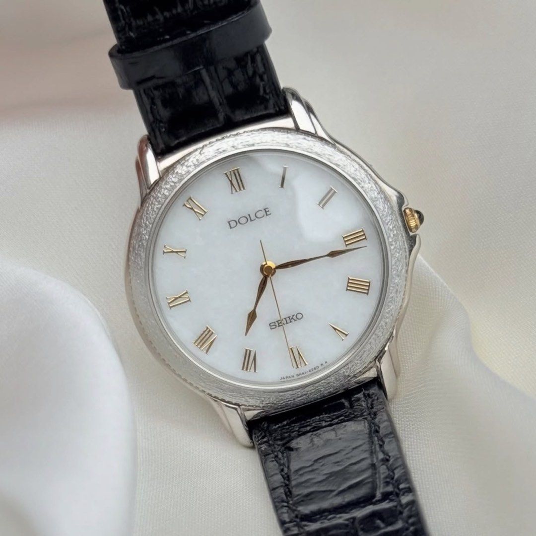 Seiko Dolce Marble White Dial (natural stone) (Category: Women's Watches) located in Lipa City. Submitted by watchoutph (Listing ID 1467550758, Image 1). Description: Very Rare Seiko Dolce Marble Natural Stone Dial Quartz Roman Indices Marble/White Stone Dial Textured bezel (tree bark design) 33mm Clean Dial and Glass Gold hands and crown Black onyx crown Collector's Item Looks just as good on women, too! (Unisex) ₱12,500.