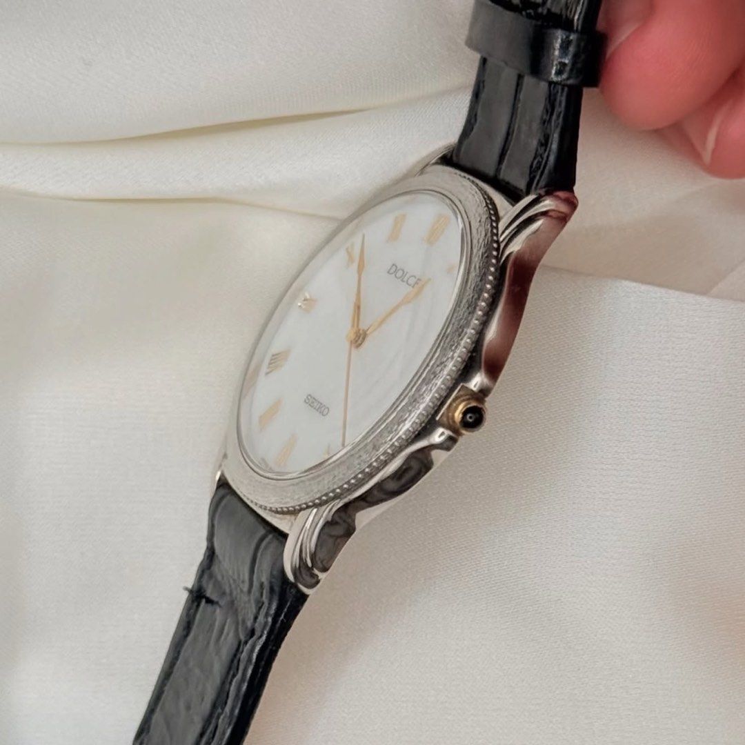 Seiko Dolce Marble White Dial (natural stone) (Category: Women's Watches) located in Lipa City. Submitted by watchoutph (Listing ID 1467550758, Image 2). Description: Very Rare Seiko Dolce Marble Natural Stone Dial Quartz Roman Indices Marble/White Stone Dial Textured bezel (tree bark design) 33mm Clean Dial and Glass Gold hands and crown Black onyx crown Collector's Item Looks just as good on women, too! (Unisex) ₱12,500.