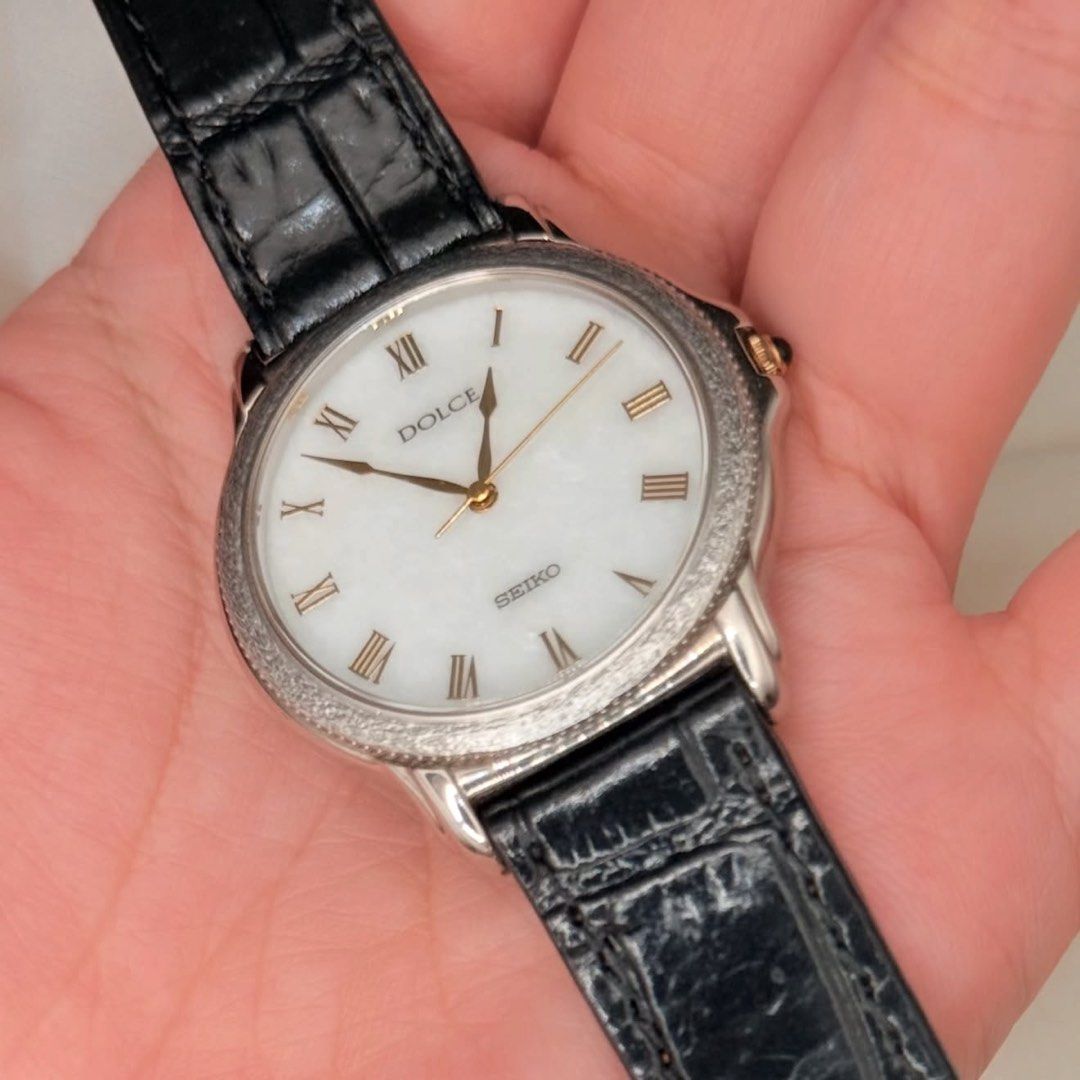 Seiko Dolce Marble White Dial (natural stone) (Category: Women's Watches) located in Lipa City. Submitted by watchoutph (Listing ID 1467550758, Image 3). Description: Very Rare Seiko Dolce Marble Natural Stone Dial Quartz Roman Indices Marble/White Stone Dial Textured bezel (tree bark design) 33mm Clean Dial and Glass Gold hands and crown Black onyx crown Collector's Item Looks just as good on women, too! (Unisex) ₱12,500.