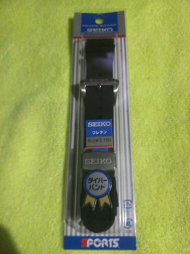 SEIKO Rubber Dive Watch Band Black (Category: Men's Watches) located in Manila. Submitted by carloskilo (Listing ID 1467492871, Image 3). Description: - Brand: Seiko - Material: Durable black polyurethane - Hardware: Stainless steel buckle and keeper with Seiko branding - Condition: Brand new with original packaging and wrapper - Authenticity: Japanese text and retail price label included on the wrapper 22 mm original rubber strap. meet up only s